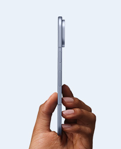 A hand holding the Google Pixel 10 Pro Fold sideways, demonstrating its slim profile