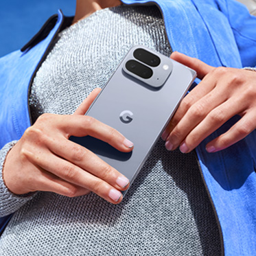 A person holding the Google Pixel 10 Pro Fold phone, showing the back and its camera module