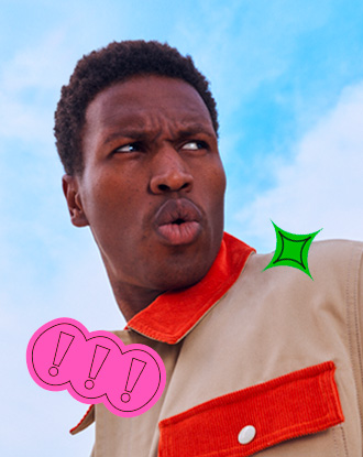 A headshot of an adult individual with short, dark hair, looking off to their right with a surprised expression