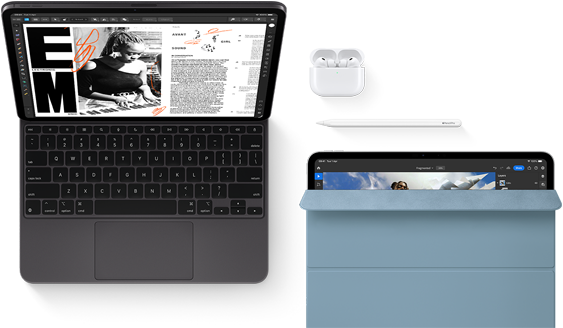 iPad Pro attached to Magic Keyboard, front exterior, space black colour, rounded corners, black display bezel, open, display showing article editing app with text and photograph of a woman playing music, Airpods 4 in open case, blue Smart Folio cover on iPad Pro with Apple Pencil Pro resting atop device, cover slightly open revealing display